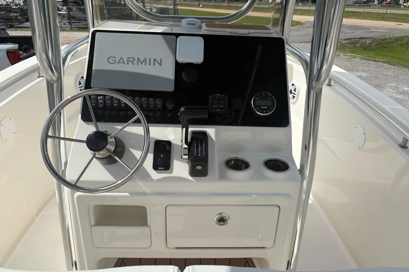 Slide: The Image of 2024 Bulls Bay 230 Center Console boat dashboard with Garmin navigation system. - 9