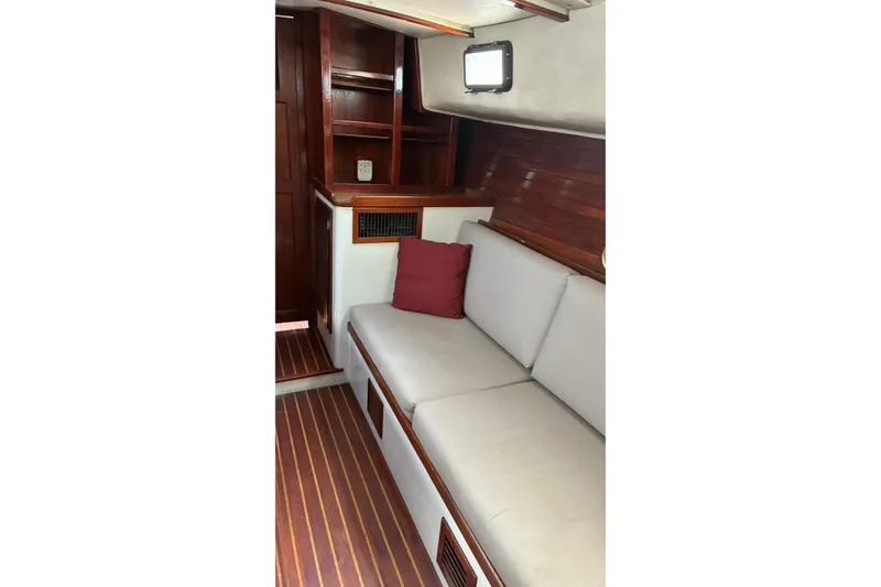 Slide: The Image of Interior of 1979 Downeast DE38 yacht with wooden finish and cushioned seating. - 15