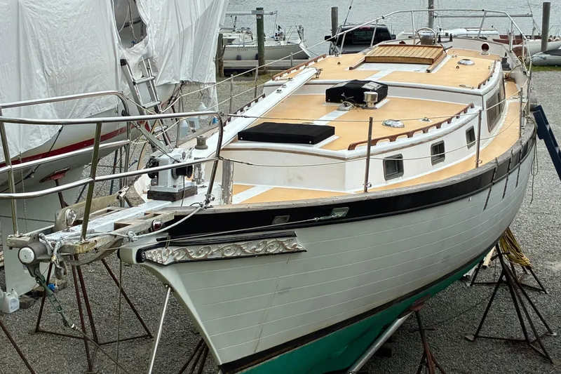 Slide: The Image of 1979 Downeast DE38 sailboat on stands, docked for maintenance. - 7