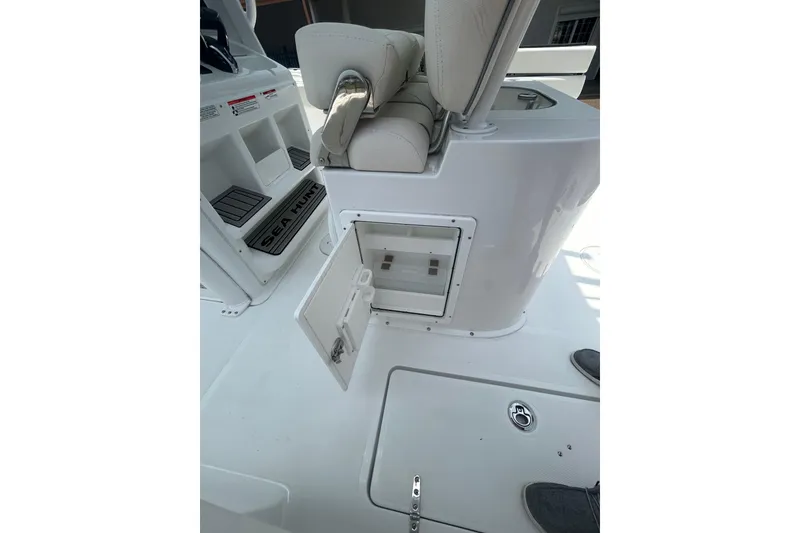 Slide: The Image of 2026 Sea Hunt Gamefish 27 Coffin Box interior with open storage compartment. - 13