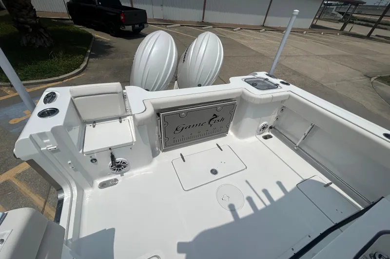 Slide: The Image of 2026 Sea Hunt Gamefish 27 Coffin Box boat interior with dual engines and fishing amenities. - 15