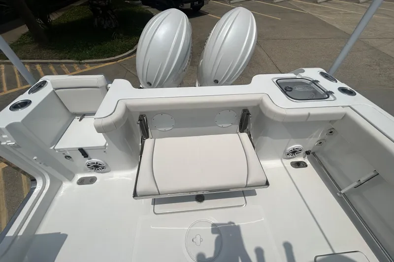 Slide: The Image of 2026 Sea Hunt Gamefish 27 Coffin Box boat interior with seating and storage features. - 17