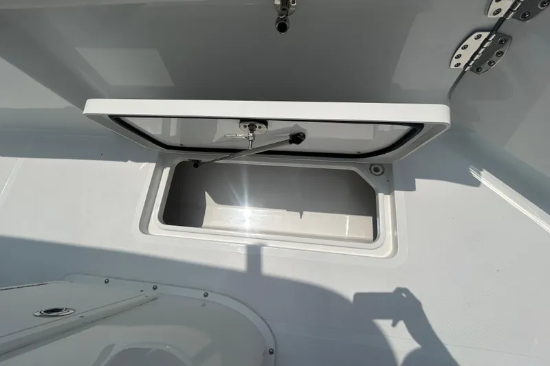 Slide: The Image of Open storage compartment on 2026 Sea Hunt Gamefish 27 Coffin Box boat. - 21