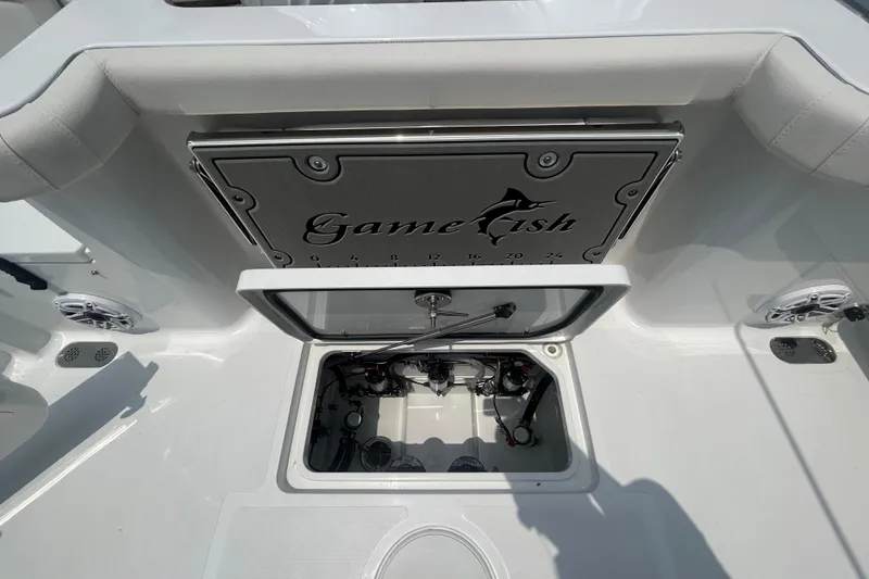 Slide: The Image of 2026 Sea Hunt Gamefish 27 Coffin Box interior with open storage compartment. - 22