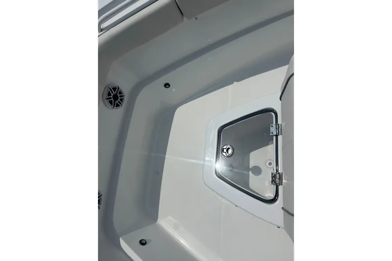 Slide: The Image of 2026 Sea Hunt Gamefish 27 Coffin Box interior with storage compartment and speaker. - 7