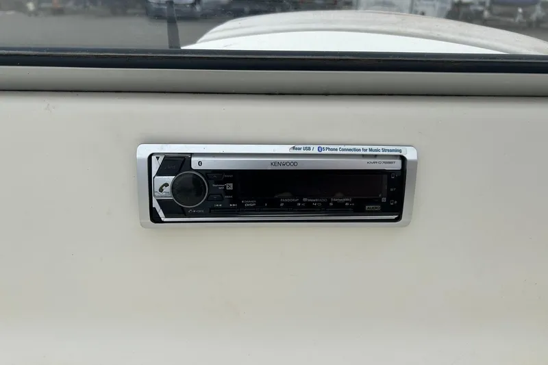 Slide: The Image of Kenwood stereo system in 2003 Bayliner 175 Bowrider boat dashboard. - 12