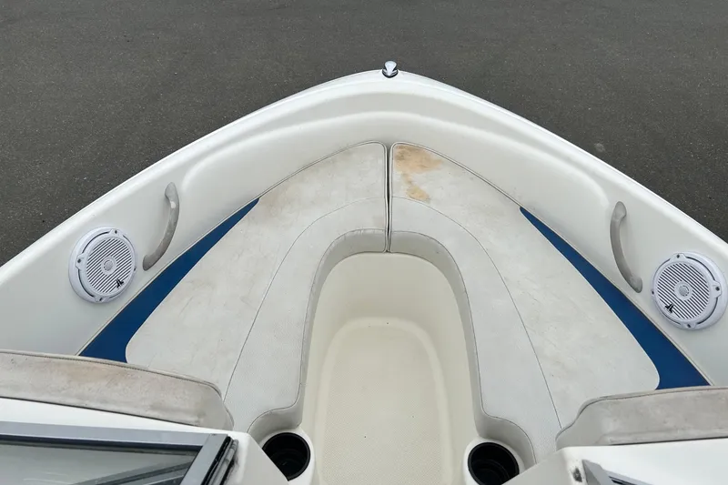 Slide: The Image of 2003 Bayliner 175 Bowrider boat interior with seating and speakers. - 4