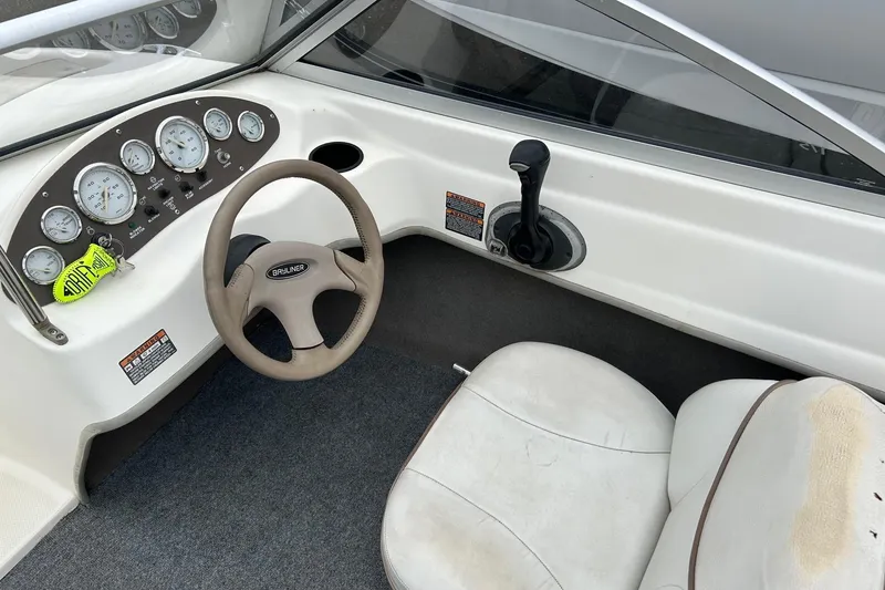 Slide: The Image of 2003 Bayliner 175 Bowrider dashboard with steering wheel and instrument panel. - 5
