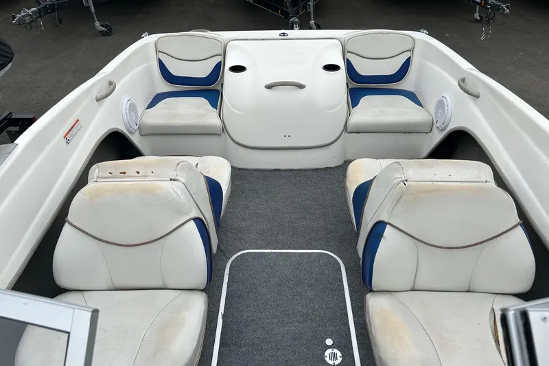 Slide: The Image of Interior of a 2003 Bayliner 175 Bowrider boat with white and blue seating. - 9