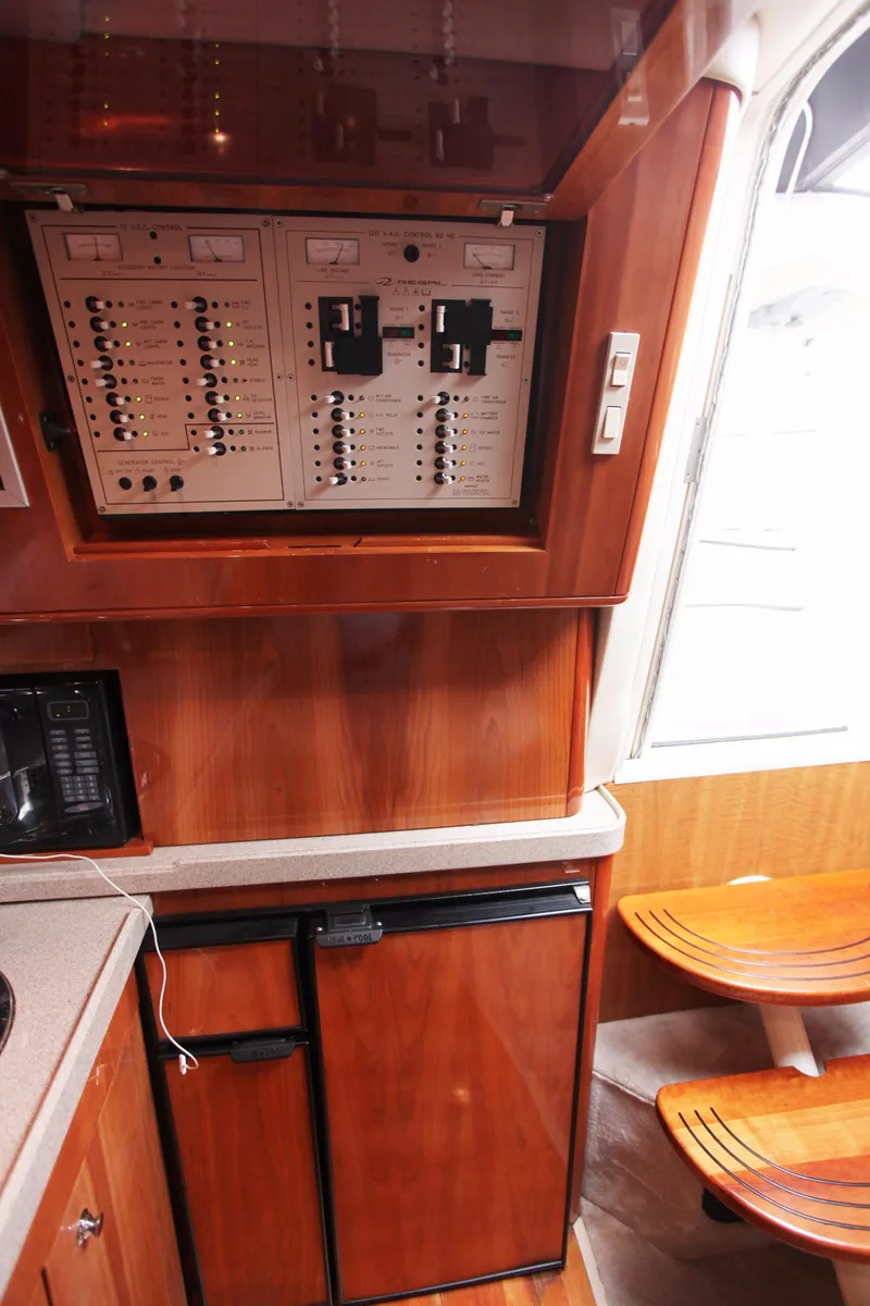 Slide: The Image of Interior of 2002 Regal Commodore 4260 yacht with control panel. - 15