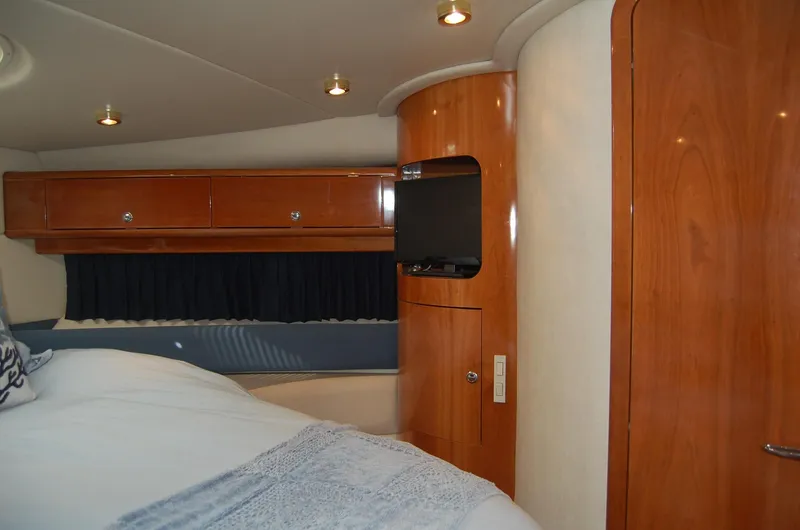 Slide: The Image of Interior of 2002 Regal Commodore 4260 yacht with wooden cabinetry. - 19