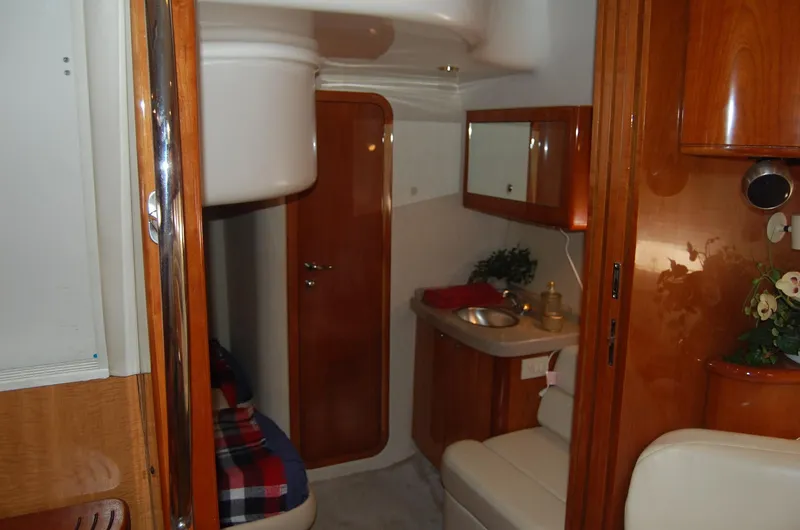 Slide: The Image of Interior of 2002 Regal Commodore 4260 yacht with wooden finish. - 23