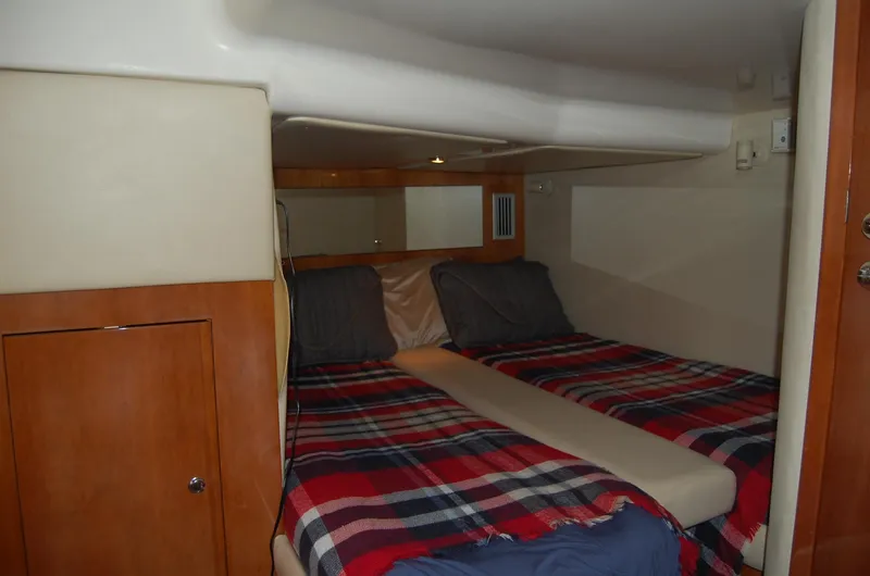 Slide: The Image of Interior of 2002 Regal Commodore 4260 yacht with cozy sleeping area. - 25