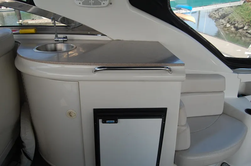Slide: The Image of Interior of 2002 Regal Commodore 4260 yacht with sink and refrigerator. - 37