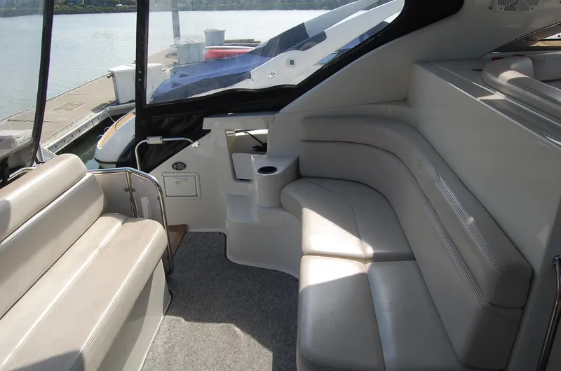 Slide: The Image of Interior of a 2002 Regal Commodore 4260 yacht with comfortable seating. - 38