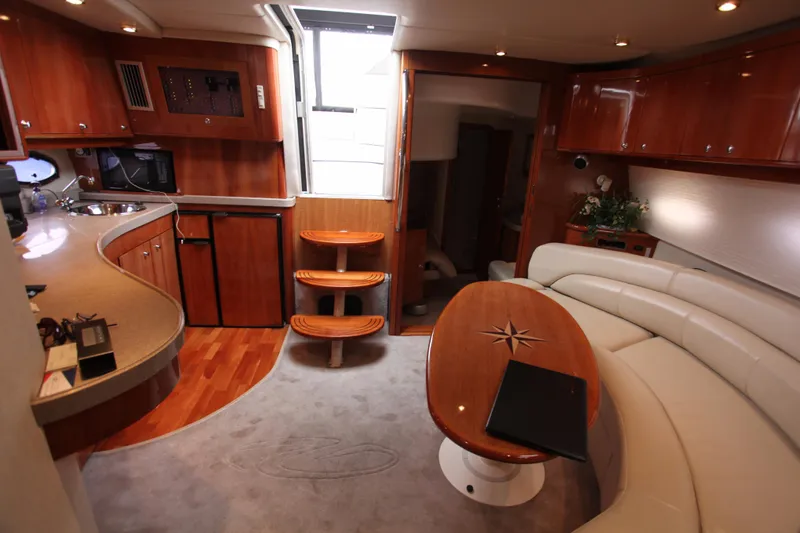 Slide: The Image of Interior of 2002 Regal Commodore 4260 yacht with elegant furnishings. - 4