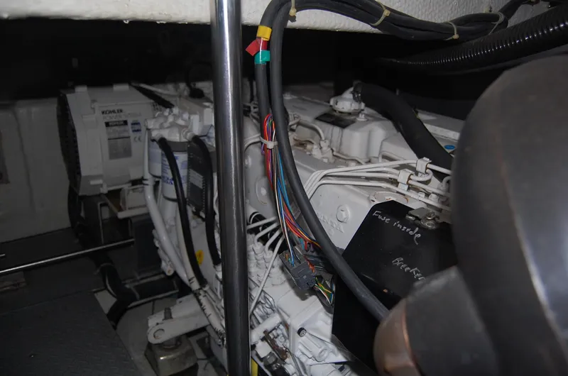 Slide: The Image of Engine room of 2002 Regal Commodore 4260 with cables and engine. - 43