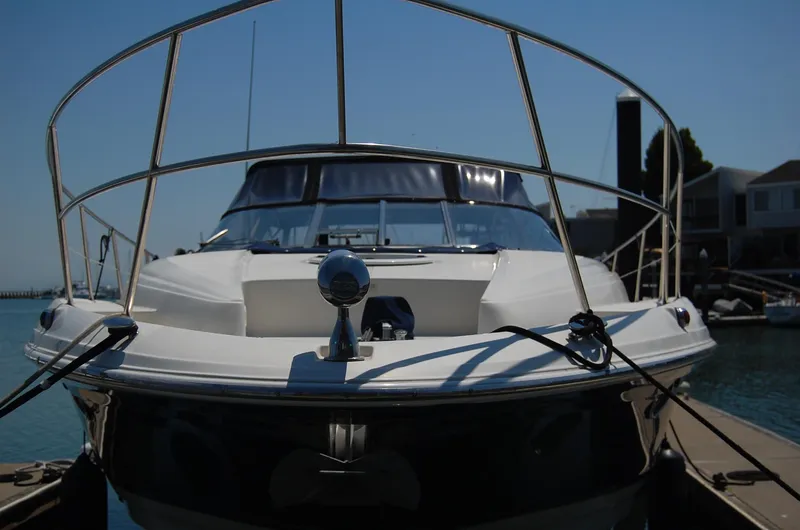 Slide: The Image of 2002 Regal Commodore 4260 yacht docked, front view. - 47