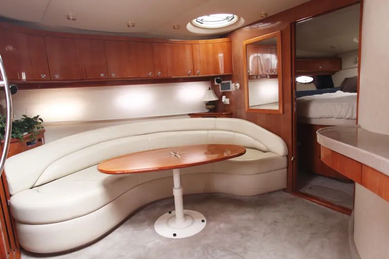 Slide: The Image of 2002 Regal Commodore 4260 yacht interior with curved seating. - 5