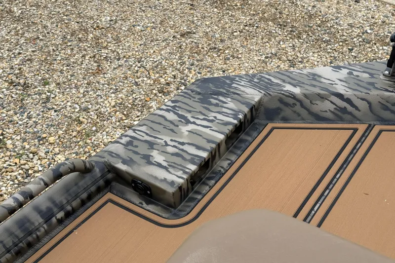 Slide: The Image of 2026 Excel 1860 Viper F4 boat with camouflage design and textured flooring. - 11