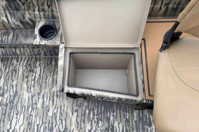 Slide: The Image of Open storage compartment in 2026 Excel 1860 Viper F4 boat with camouflage pattern. - 17