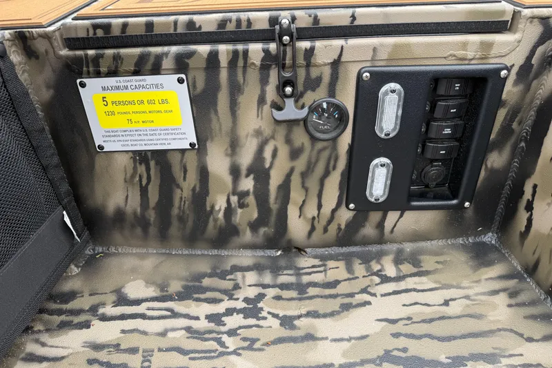 Slide: The Image of Control panel of 2026 Excel 1860 Viper F4 boat with capacity label and switches. - 20