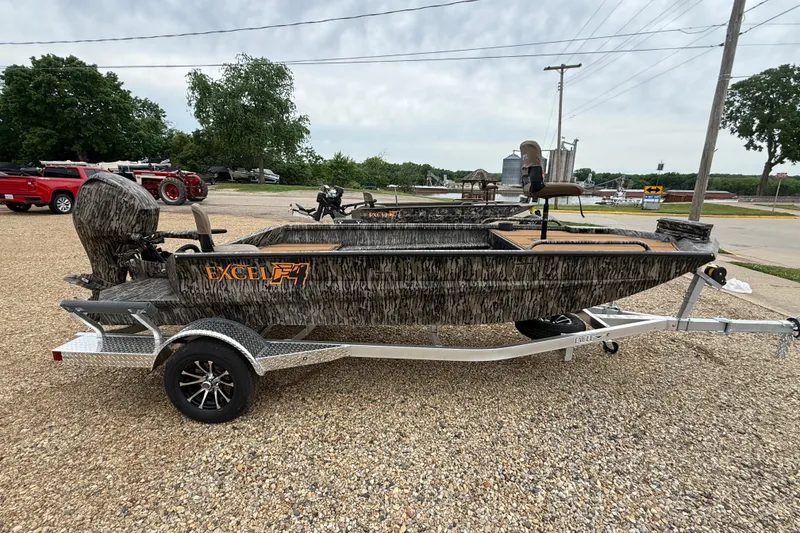 Slide: The Image of 2026 Excel 1860 Viper F4 boat on trailer, camo design, parked outdoors. - 4