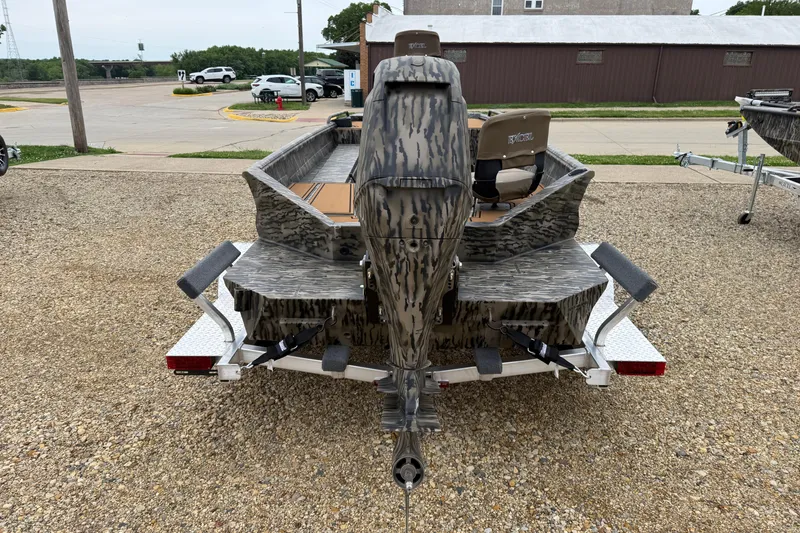 Slide: The Image of 2026 Excel 1860 Viper F4 boat on trailer, camo design, parked outdoors. - 6