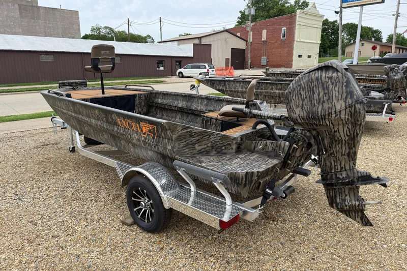 Slide: The Image of 2026 Excel 1860 Viper F4 boat on trailer, camo design, parked outdoors. - 7