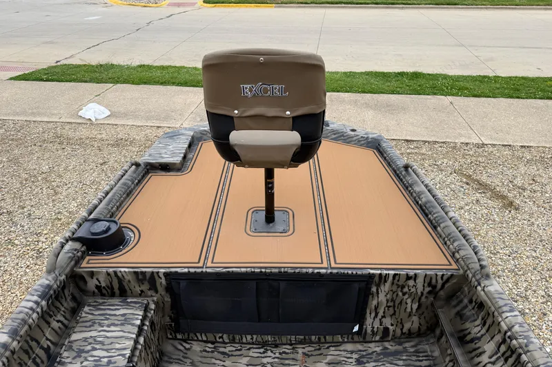 Slide: The Image of 2026 Excel 1860 Viper F4 boat with camo design and swivel seat. - 9