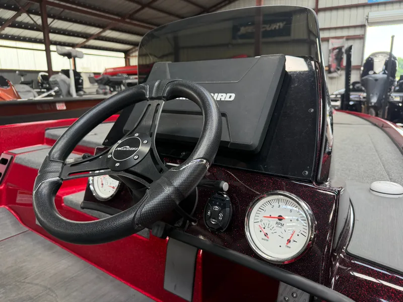 Slide: The Image of Falcon T20TE 2022 boat dashboard with steering wheel and gauges. - 14