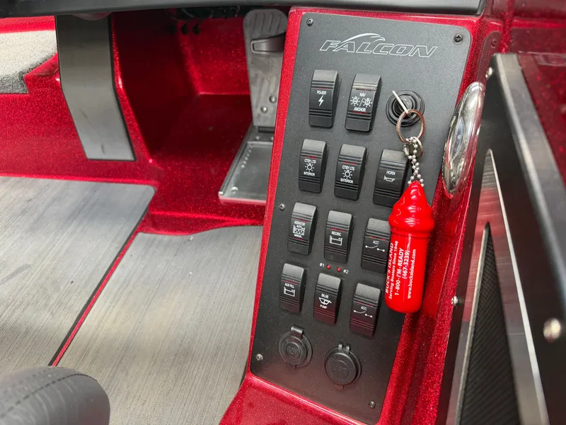 Slide: The Image of Falcon T20TE 2022 control panel with switches and keychain. - 15