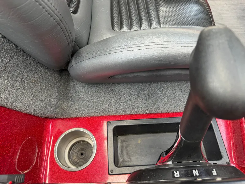 Slide: The Image of Interior of Falcon T20TE 2022 with gear shift and cup holder. - 16