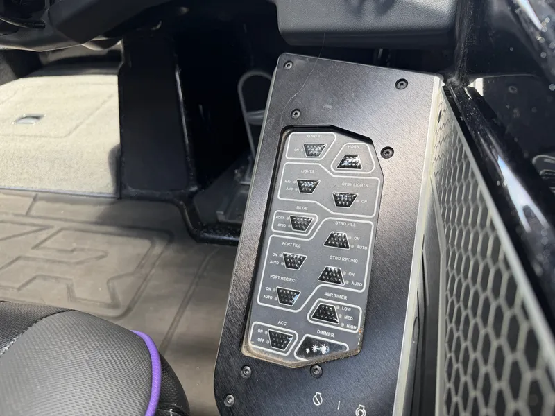 Slide: The Image of Control panel of 2024 Skeeter FXR20 boat with switches. - 16