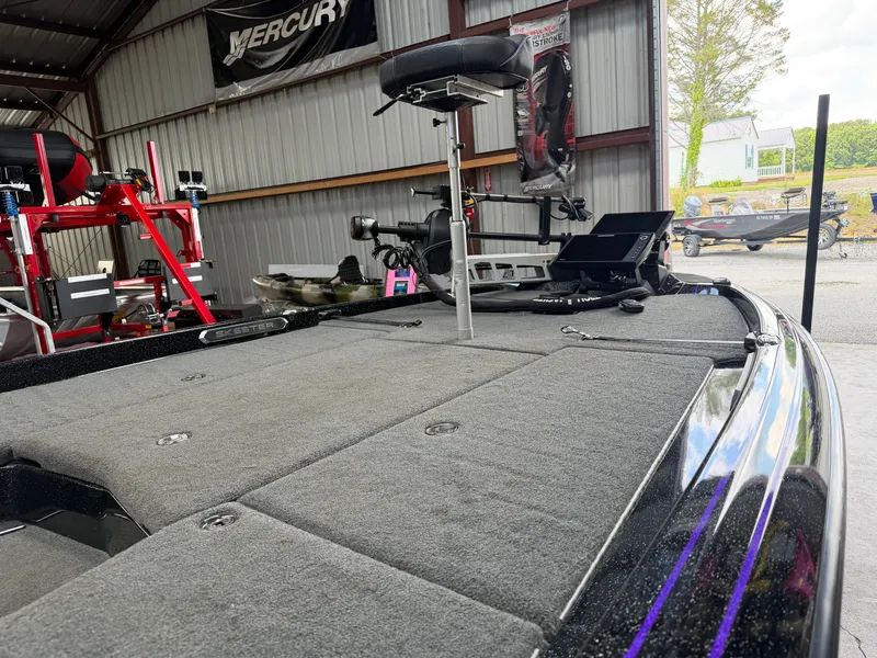 Slide: The Image of 2024 Skeeter FXR20 boat in a workshop with equipment. - 5