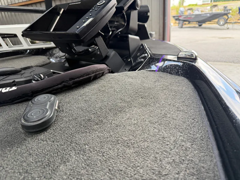 Slide: The Image of Interior view of a 2024 Skeeter FXR20 boat with controls. - 7