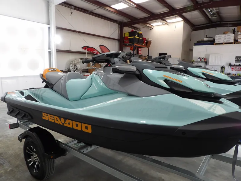 Slide: The Image of 2023 Sea-Doo Wake 170 jet ski in warehouse. - 7