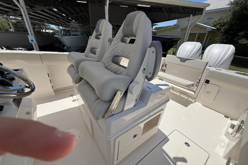Slide: The Image of Interior of 2026 Sailfish 312 CC boat featuring luxurious seating and modern design. - 17