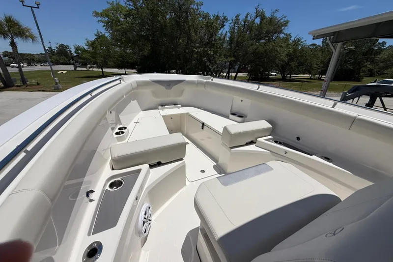 Slide: The Image of 2026 Sailfish 312 CC boat interior with spacious seating and cup holders. - 19