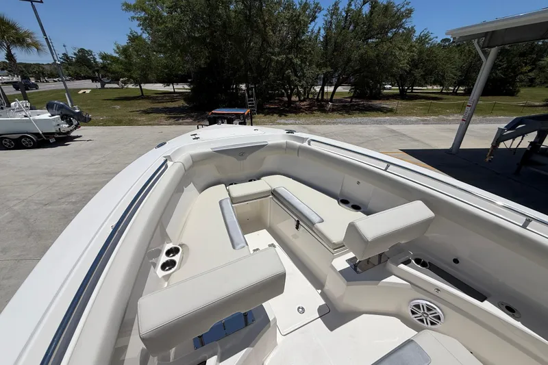 Slide: The Image of 2026 Sailfish 312 CC boat interior with spacious seating and cup holders. - 20