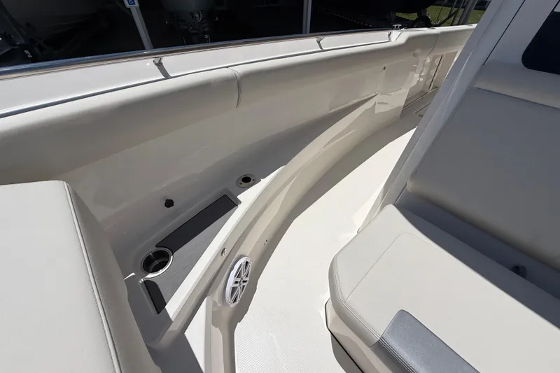 Slide: The Image of 2026 Sailfish 312 CC boat interior with seating and cup holders. - 22