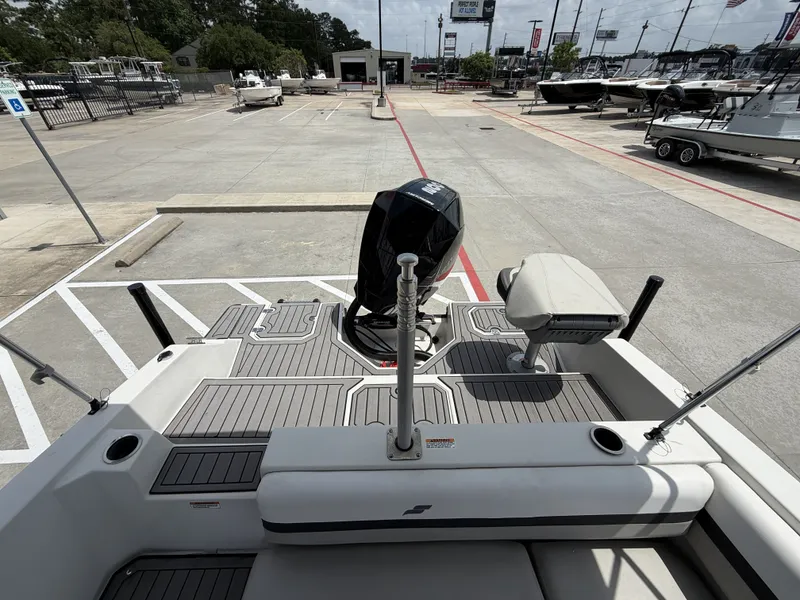 Slide: The Image of Starcraft SXV-211 boat 2023 on parking lot with outboard motor. - 11