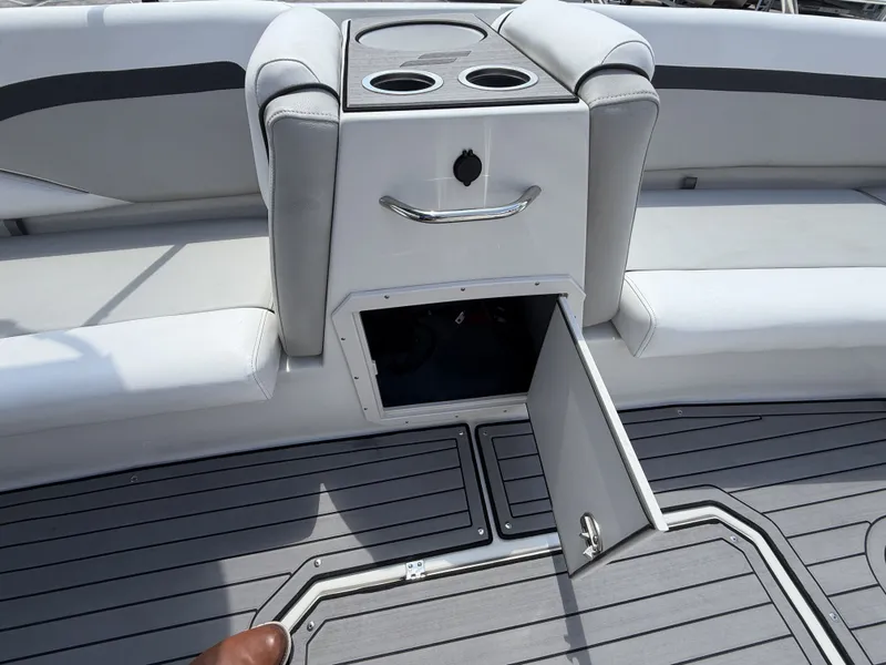 Slide: The Image of Starcraft SXV-211 boat with open storage and cup holders, 2023 model. - 23
