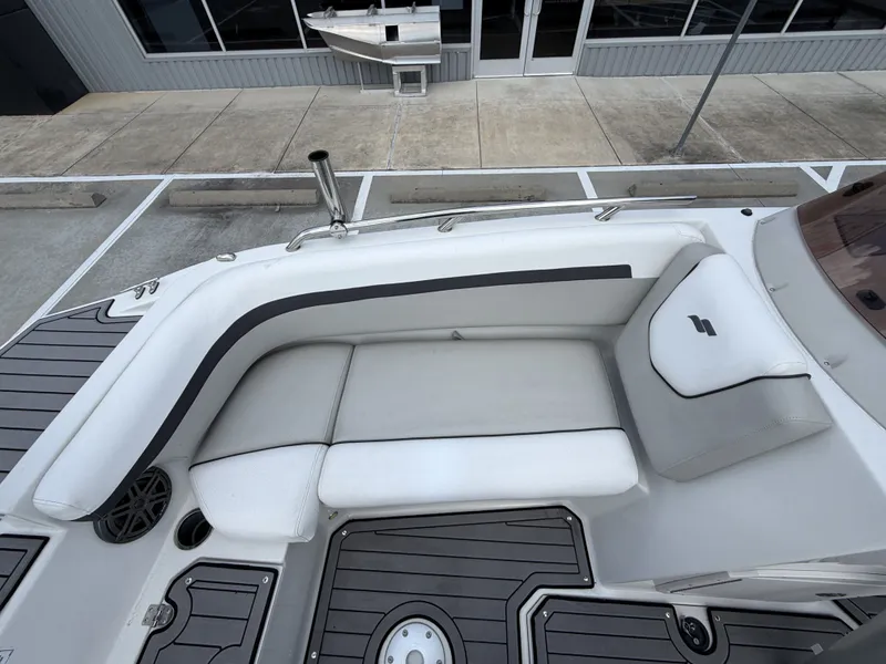 Slide: The Image of 2023 Starcraft SXV-211 boat with white seating and gray flooring. - 26