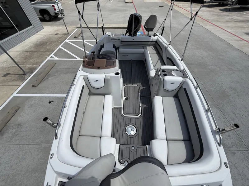 Slide: The Image of 2023 Starcraft SXV-211 boat interior with seating and helm station. - 28