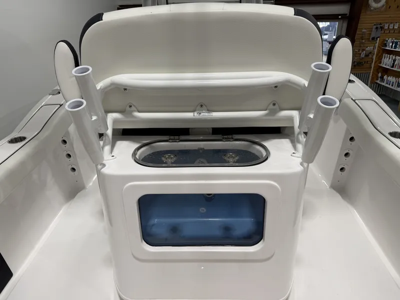 Slide: The Image of 2026 Tidewater 232 CC Adventure boat with fishing rod holders. - 19