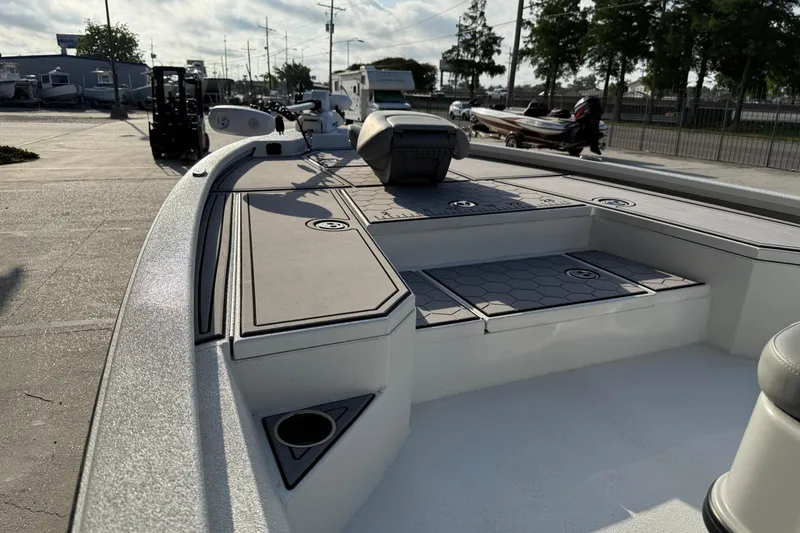 Slide: The Image of 2022 Avid 23 FS Magnum boat interior with seating and storage compartments. - 13