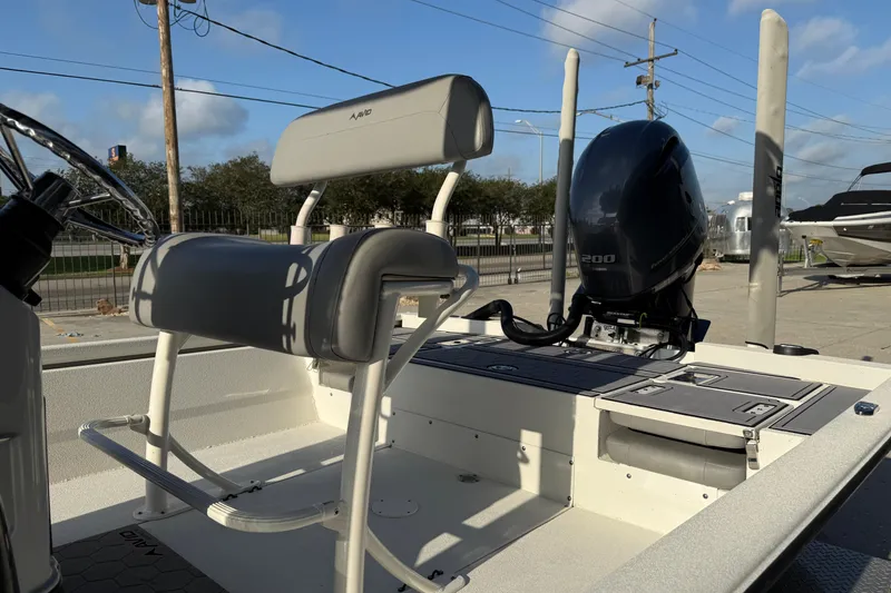 Slide: The Image of 2022 Avid 23 FS Magnum boat with seating and powerful outboard motor. - 16