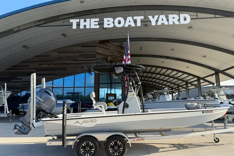 Slide: The Image of 2022 Avid 23 FS Magnum boat displayed at The Boat Yard dealership. - 3