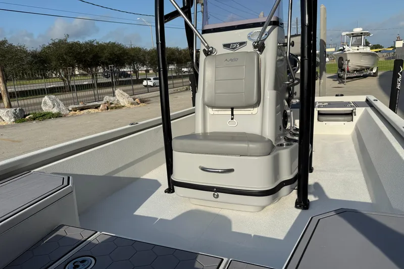 Slide: The Image of 2022 Avid 23 FS Magnum boat interior with seating and console. - 9